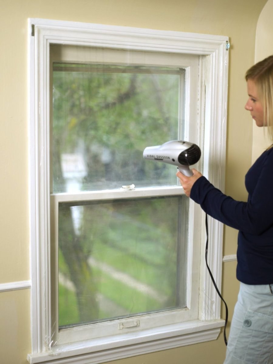 Installing plastic window wrap