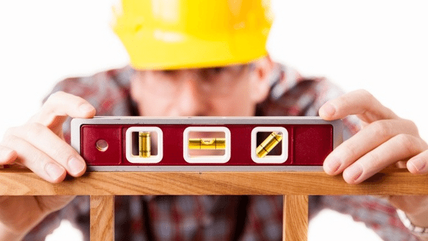 5-home-projects-where-diy-does-not-make-sense_1-png Contractor using a level