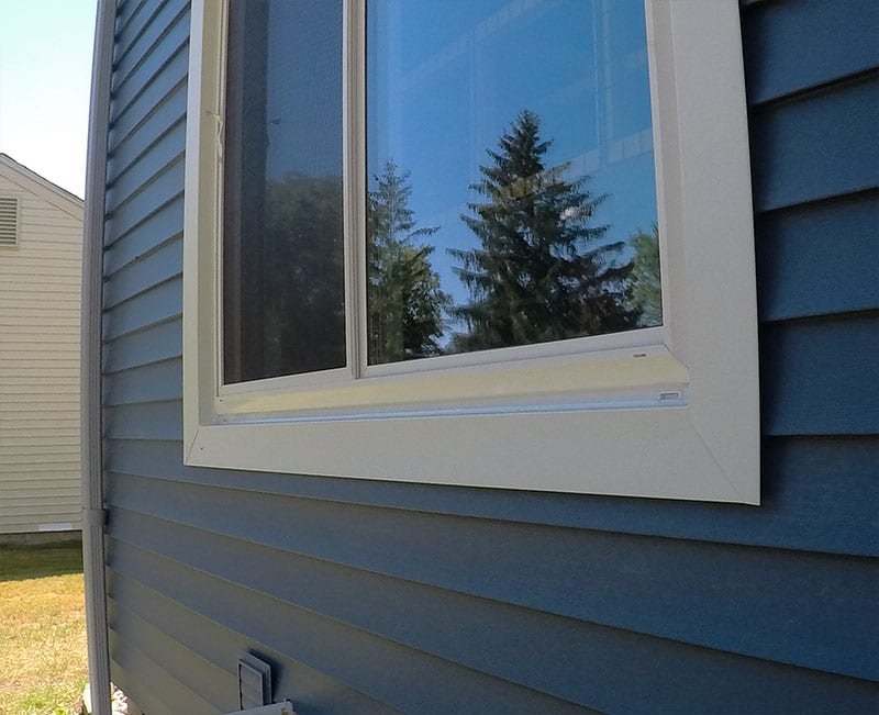 West Bloomfield Siding, Windows, and Gutters Back Window Frame After Install