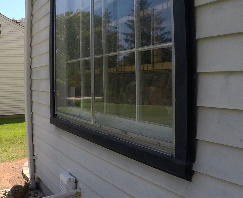 West Bloomfield Siding, Windows, and Gutters Back Window Frame Before Install