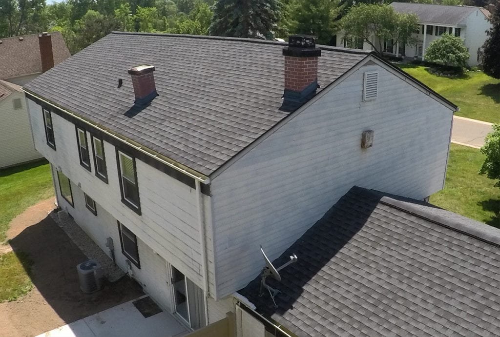 West Bloomfield Siding, Windows, and Gutters Drone Back Right Before Install