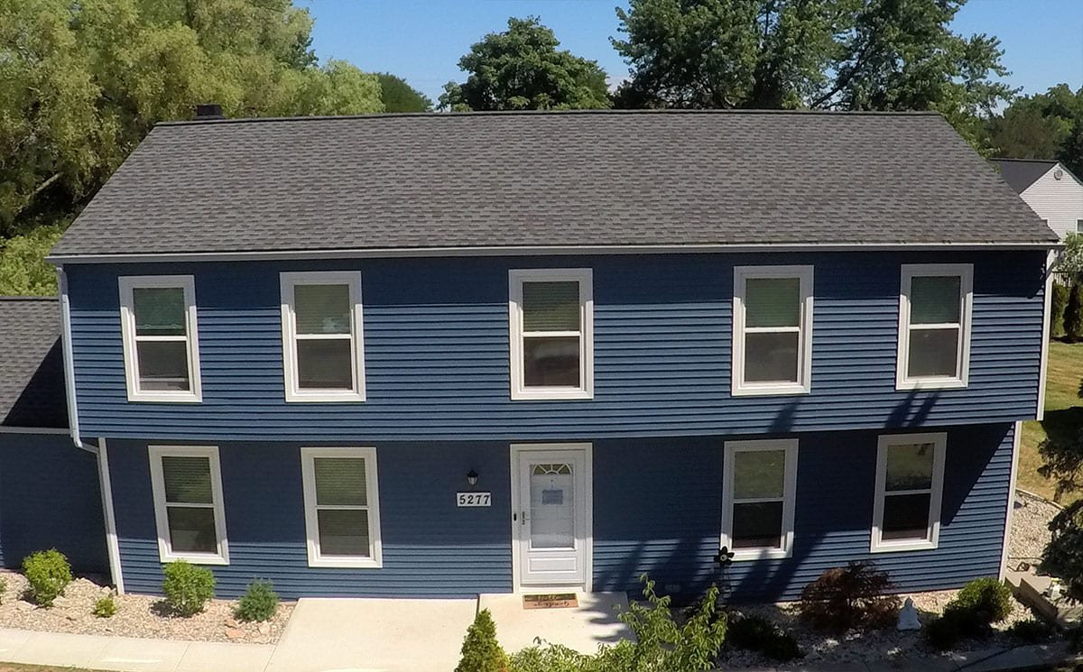 West Bloomfield Siding, Windows, and Gutters Drone Front After Install