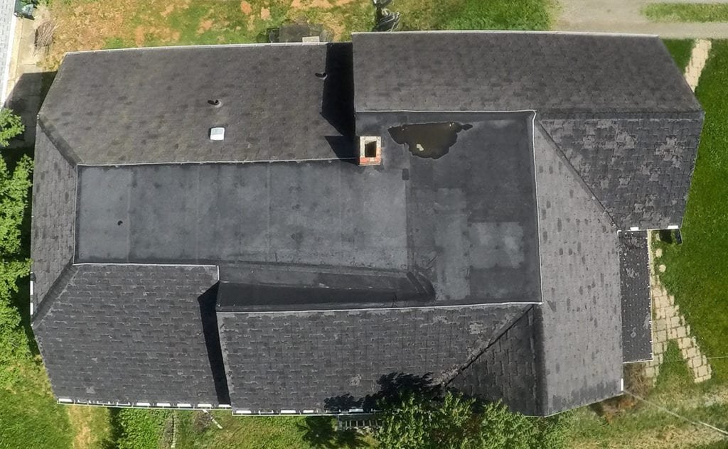 Adrian Roofing, Siding, and Gutters Roof Top Before Install