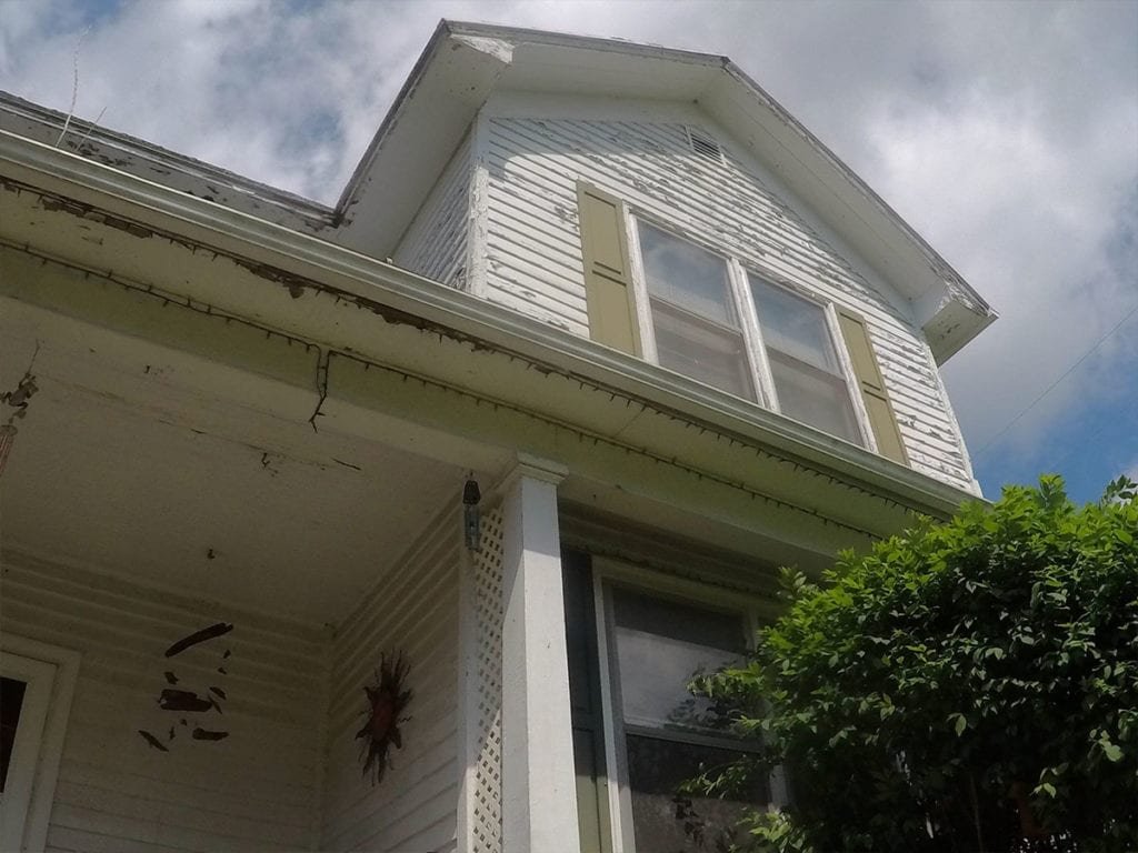 Adrian Roofing, Siding, and Gutters Front Porch Before Install