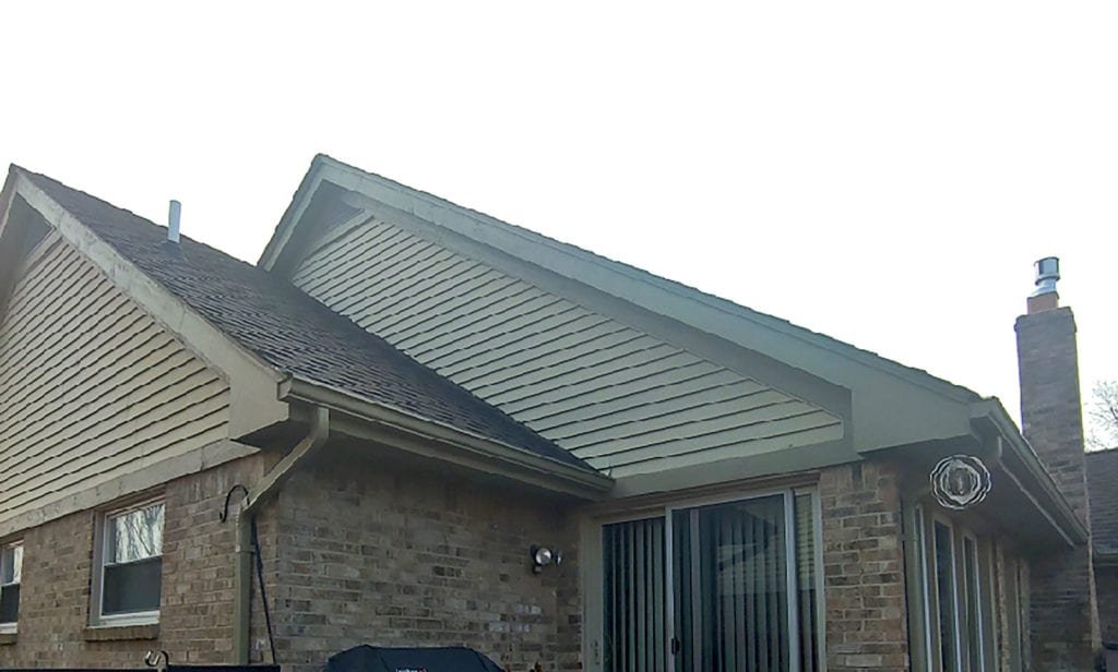 Woodhaven siding and gutter replacement - Back Left Before Install