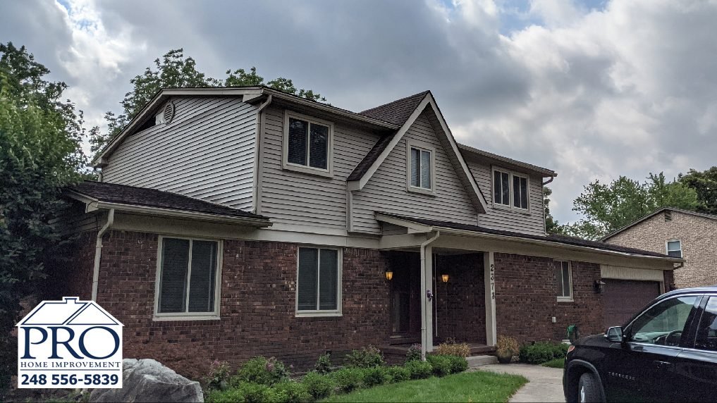 Troy Siding & Gutters Replacement - Front Left Before